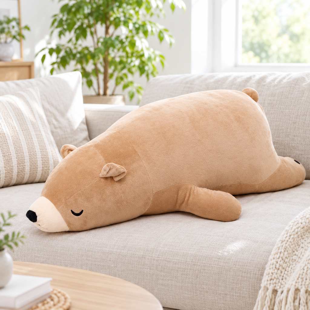Brown chill bear plushie without shirt on a living room sofa