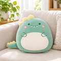Dino pancake plushie pillow on a living room sofa