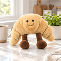 Croissant plushie on a kitchen counter
