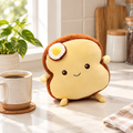 Brown egg on toast plushie on a kitchen counter
