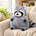 Chubby raccoon plushie on a cozy armchair